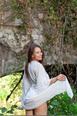 Sumiko Slips A White Robe Off Under The Stone Arch - 01
