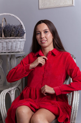 Zarusha Strips Out Of A Red Shirt Dress On A White Wicker Chair - 01