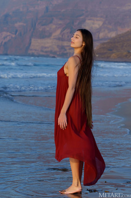Shelena Drops A Sheer Wrap On A Rocky Coastline At Sunset - 00