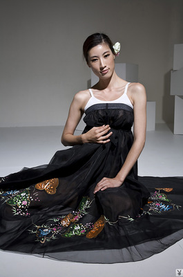 Eunkyung Oh Slips Out Of A Black Butterfly Gown In A White Studio - 01