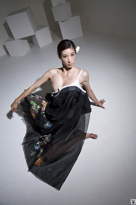 Eunkyung Oh Slips Out Of A Black Butterfly Gown In A White Studio - 03