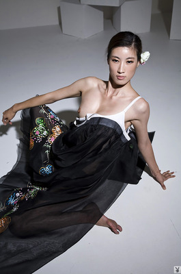 Eunkyung Oh Slips Out Of A Black Butterfly Gown In A White Studio - 04