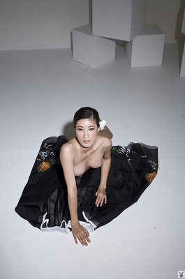 Eunkyung Oh Slips Out Of A Black Butterfly Gown In A White Studio - 09