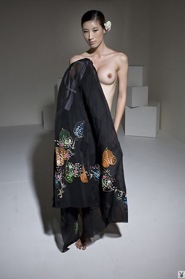 Eunkyung Oh Slips Out Of A Black Butterfly Gown In A White Studio - 17