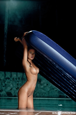 Jevgenija Tischenko Floats Bare On A Blue Air Mattress Over Teal Water - 06